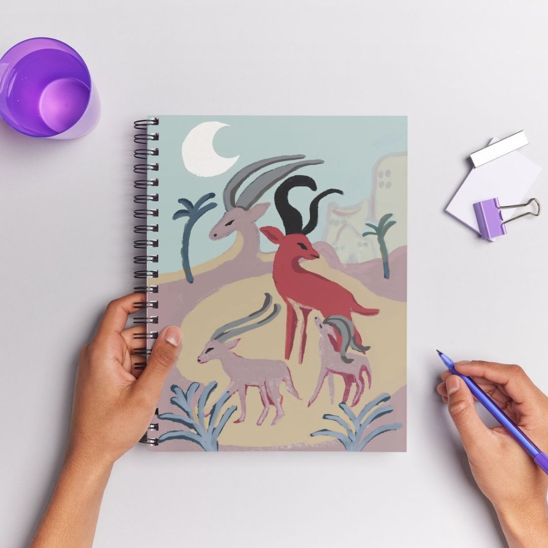 Gazelle Sanctuary artwork on the cover of a spiral notebook
